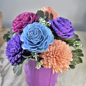 The violet color wheel. Sola wood flowers arranged in striking contrasts